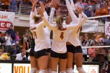 UT sophomore Heather Kisner (#19, DS), UT senior Michelle Moriarty (#4, S), and UT sophomore Ashley Engle (#10, S/RS) celebrate a point with their teammates.  The Longhorns defeated the Huskers 3-0 on Wednesday night, October 24, 2007 at Gregory Gym.

Filename: SRM_20071024_1837469.jpg
Aperture: f/4.5
Shutter Speed: 1/400
Body: Canon EOS-1D Mark II
Lens: Canon EF 80-200mm f/2.8 L
