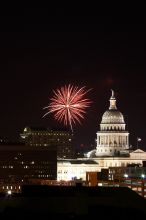 Austin Independence Day fireworks with the Capitol building, as viewed from atop the Manor Garage at The University of Texas at Austin.  The fireworks were launched from Auditorium Shores, downtown Austin, Friday, July 4, 2008.

Filename: SRM_20080704_2141344.jpg
Aperture: f/11.0
Shutter Speed: 6/1
Body: Canon EOS 20D
Lens: Canon EF 80-200mm f/2.8 L