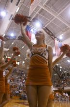 Lacy Rudd cheers for UT at a volleyball game.  The University of Texas women's volleyball team defeated Oklahoma State University (OSU) 3-2 on Saturday, October 21, 2006.

Filename: SRM_20061021_1949263.jpg
Aperture: f/5.0
Shutter Speed: 1/160
Body: Canon EOS DIGITAL REBEL
Lens: Canon EF-S 18-55mm f/3.5-5.6