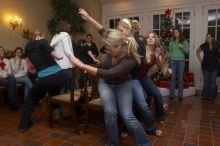 Lindsay Fraley, center, Kaitlen Heeren, and Emily Skipper (in maroon) playing musical chairs at the Alpha Delta Pi Christmas party, Sunday, December 10, 2006.

Filename: SRM_20061210_1813323.jpg
Aperture: f/7.1
Shutter Speed: 1/30
Body: Canon EOS 20D
Lens: Canon EF-S 18-55mm f/3.5-5.6