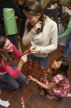 Kathlyn Parr, in pink, helps Jessica Liu dress Meghan Doege in a wrapping-paper garment at the Alpha Delta Pi Christmas party, Sunday, December 10, 2006.

Filename: SRM_20061210_1835407.jpg
Aperture: f/5.0
Shutter Speed: 1/100
Body: Canon EOS 20D
Lens: Canon EF-S 18-55mm f/3.5-5.6