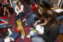 Beth Leeker, Reem Hafez, Megan Watson, Emily Skipper, and Ashley Marz (from left) opening gifts at the Alpha Delta Pi Christmas party, Sunday, December 10, 2006.

Filename: SRM_20061210_1903100.jpg
Aperture: f/7.1
Shutter Speed: 1/100
Body: Canon EOS 20D
Lens: Canon EF-S 18-55mm f/3.5-5.6