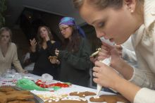 Lauren Fletcher puts frosting on a gingerbread man as Allison Grady, Jessica Hensarly, and Lauren Stewart (from right) eat theirs at the Alpha Delta Pi Christmas party, Sunday, December 10, 2006.

Filename: SRM_20061210_1905567.jpg
Aperture: f/7.1
Shutter Speed: 1/100
Body: Canon EOS 20D
Lens: Canon EF-S 18-55mm f/3.5-5.6