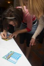 Molly Watson scratching off lottery tickets at the Alpha Delta Pi Christmas party, Sunday, December 10, 2006.

Filename: SRM_20061210_1914089.jpg
Aperture: f/7.1
Shutter Speed: 1/100
Body: Canon EOS 20D
Lens: Canon EF-S 18-55mm f/3.5-5.6