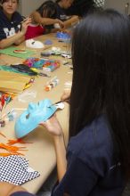 Jenny Hsu decorates a mask at a domestic violence expressive arts workshop for survivors and friends of survivors of domestic and relationship violence.

Filename: SRM_20061023_1729469.jpg
Aperture: f/5.6
Shutter Speed: 1/100
Body: Canon EOS 20D
Lens: Canon EF-S 18-55mm f/3.5-5.6