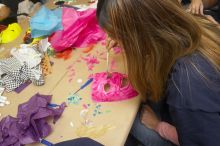 Sharon Kim decorates her mask at a domestic violence expressive arts workshop for survivors and friends of survivors of domestic and relationship violence.

Filename: SRM_20061023_1756520.jpg
Aperture: f/5.6
Shutter Speed: 1/100
Body: Canon EOS 20D
Lens: Canon EF-S 18-55mm f/3.5-5.6