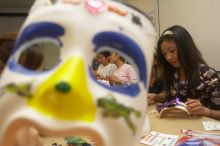 Through the eyes of Rita Saynhalath's mask, from the right, Christine Achico, Diane Nguyen, and Hannah Yee at a domestic violence expressive arts workshop for survivors and friends of survivors of domestic and relationship violence.

Filename: SRM_20061023_1810106.jpg
Aperture: f/5.6
Shutter Speed: 1/100
Body: Canon EOS 20D
Lens: Canon EF-S 18-55mm f/3.5-5.6