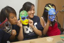 From the left, Steph Nhem, Stephanie Luu, and Tanushri Tarafder show off their masks at a domestic violence expressive arts workshop for survivors and friends of survivors of domestic and relationship violence.

Filename: SRM_20061023_1813289.jpg
Aperture: f/5.6
Shutter Speed: 1/100
Body: Canon EOS 20D
Lens: Canon EF-S 18-55mm f/3.5-5.6