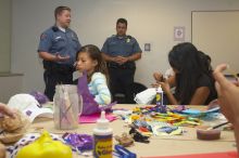 Officer Wesley Schlather talks about the UT RAD program at a domestic violence expressive arts workshop for survivors and friends of survivors of domestic and relationship violence.

Filename: SRM_20061023_1816443.jpg
Aperture: f/5.6
Shutter Speed: 1/100
Body: Canon EOS 20D
Lens: Canon EF-S 18-55mm f/3.5-5.6