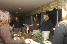 Sisters sing in prayer before dinner at the Alpha Xi Delta Christmas dinner, Friday, December 4, 2006.

Filename: SRM_20061204_1811425.jpg
Aperture: f/6.3
Shutter Speed: 1/250
Body: Canon EOS 20D
Lens: Canon EF-S 18-55mm f/3.5-5.6