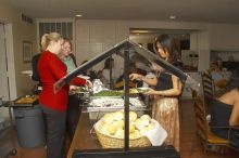 Veronica Hamlett, in green, and Joy Ching, on right, get food at the Alpha Xi Delta Christmas dinner, Friday, December 4, 2006.

Filename: SRM_20061204_1814469.jpg
Aperture: f/6.3
Shutter Speed: 1/250
Body: Canon EOS 20D
Lens: Canon EF-S 18-55mm f/3.5-5.6