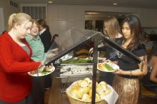 Veronica Hamlett, in green, and Joy Ching, on right, get food at the Alpha Xi Delta Christmas dinner, Friday, December 4, 2006.

Filename: SRM_20061204_1815000.jpg
Aperture: f/6.3
Shutter Speed: 1/250
Body: Canon EOS 20D
Lens: Canon EF-S 18-55mm f/3.5-5.6