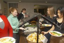 Veronica Hamlett, in green, and Joy Ching, on right, get food at the Alpha Xi Delta Christmas dinner, Friday, December 4, 2006.

Filename: SRM_20061204_1815021.jpg
Aperture: f/6.3
Shutter Speed: 1/250
Body: Canon EOS 20D
Lens: Canon EF-S 18-55mm f/3.5-5.6