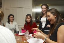 Mandy Mauldin, center, gives presents to Jessica Schreyer, left, and Allison Leah, right, at the Alpha Xi Delta Christmas dinner, Friday, December 4, 2006.

Filename: SRM_20061204_1815222.jpg
Aperture: f/6.3
Shutter Speed: 1/250
Body: Canon EOS 20D
Lens: Canon EF-S 18-55mm f/3.5-5.6