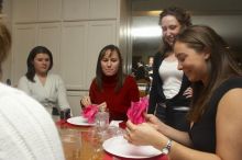 Mandy Mauldin, center, gives presents to Jessica Schreyer, left, and Allison Lear, right, at the Alpha Xi Delta Christmas dinner, Friday, December 4, 2006.

Filename: SRM_20061204_1815243.jpg
Aperture: f/6.3
Shutter Speed: 1/250
Body: Canon EOS 20D
Lens: Canon EF-S 18-55mm f/3.5-5.6