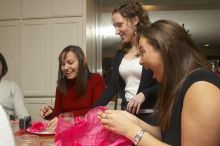 Mandy Mauldin, center, gives presents to Jessica Schreyer, left, and Allison Lear, right, at the Alpha Xi Delta Christmas dinner, Friday, December 4, 2006.

Filename: SRM_20061204_1815305.jpg
Aperture: f/6.3
Shutter Speed: 1/250
Body: Canon EOS 20D
Lens: Canon EF-S 18-55mm f/3.5-5.6