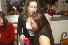 Mandy Mauldin, center, gives presents to Jessica Schreyer, left, and Allison Lear, right, at the Alpha Xi Delta Christmas dinner, Friday, December 4, 2006.

Filename: SRM_20061204_1815386.jpg
Aperture: f/6.3
Shutter Speed: 1/250
Body: Canon EOS 20D
Lens: Canon EF-S 18-55mm f/3.5-5.6