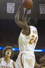 Guard Justin Mason, #24.  The longhorns defeated the Texas Southern University (TSU) Tigers 90-50 Saturday night.

Filename: SRM_20061128_1928342.jpg
Aperture: f/2.8
Shutter Speed: 1/640
Body: Canon EOS-1D Mark II
Lens: Canon EF 80-200mm f/2.8 L