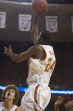 Guard Justin Mason, #24.  The longhorns defeated the Texas Southern University (TSU) Tigers 90-50 Saturday night.

Filename: SRM_20061128_1928363.jpg
Aperture: f/2.8
Shutter Speed: 1/640
Body: Canon EOS-1D Mark II
Lens: Canon EF 80-200mm f/2.8 L