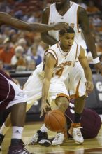 Guard D.J. Augustin, #14.  The longhorns defeated the Texas Southern University (TSU) Tigers 90-50 Tuesday night.

Filename: SRM_20061128_2013387.jpg
Aperture: f/2.8
Shutter Speed: 1/640
Body: Canon EOS-1D Mark II
Lens: Canon EF 80-200mm f/2.8 L