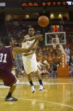 Guard A.J. Abrams, #3.  The longhorns defeated the Texas Southern University (TSU) Tigers 90-50 Tuesday night.

Filename: SRM_20061128_2020481.jpg
Aperture: f/2.8
Shutter Speed: 1/640
Body: Canon EOS-1D Mark II
Lens: Canon EF 80-200mm f/2.8 L