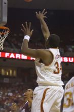 Center Dexter Pittman, #34.  The longhorns defeated the Texas Southern University (TSU) Tigers 90-50 Tuesday night.

Filename: SRM_20061128_2028541.jpg
Aperture: f/2.8
Shutter Speed: 1/640
Body: Canon EOS-1D Mark II
Lens: Canon EF 80-200mm f/2.8 L