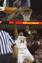 Center Dexter Pittman, #34.  The longhorns defeated the Texas Southern University (TSU) Tigers 90-50 Tuesday night.

Filename: SRM_20061128_2029524.jpg
Aperture: f/2.8
Shutter Speed: 1/640
Body: Canon EOS-1D Mark II
Lens: Canon EF 80-200mm f/2.8 L