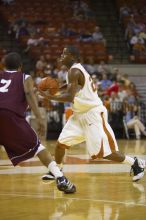 Guard Justin Mason, #24.  The longhorns defeated the Texas Southern University (TSU) Tigers 90-50 Saturday night.

Filename: SRM_20061128_2039482.jpg
Aperture: f/2.8
Shutter Speed: 1/640
Body: Canon EOS-1D Mark II
Lens: Canon EF 80-200mm f/2.8 L