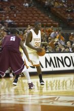 The longhorns defeated the Texas Southern University (TSU) Tigers 90-50 Tuesday night.

Filename: SRM_20061128_2039524.jpg
Aperture: f/2.8
Shutter Speed: 1/640
Body: Canon EOS-1D Mark II
Lens: Canon EF 80-200mm f/2.8 L