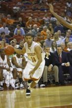 Guard D.J. Augustin, #14.  The longhorns defeated the Texas Southern University (TSU) Tigers 90-50 Tuesday night.

Filename: SRM_20061128_2044083.jpg
Aperture: f/2.8
Shutter Speed: 1/640
Body: Canon EOS-1D Mark II
Lens: Canon EF 80-200mm f/2.8 L