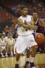 Guard D.J. Augustin, #14.  The longhorns defeated the Texas Southern University (TSU) Tigers 90-50 Tuesday night.

Filename: SRM_20061128_2044146.jpg
Aperture: f/2.8
Shutter Speed: 1/640
Body: Canon EOS-1D Mark II
Lens: Canon EF 80-200mm f/2.8 L
