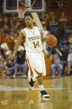 Guard D.J. Augustin, #14.  The longhorns defeated the Texas Southern University (TSU) Tigers 90-50 Tuesday night.

Filename: SRM_20061128_2045428.jpg
Aperture: f/2.8
Shutter Speed: 1/640
Body: Canon EOS-1D Mark II
Lens: Canon EF 80-200mm f/2.8 L