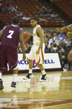 Guard D.J. Augustin, #14.  The longhorns defeated the Texas Southern University (TSU) Tigers 90-50 Tuesday night.

Filename: SRM_20061128_2045449.jpg
Aperture: f/2.8
Shutter Speed: 1/640
Body: Canon EOS-1D Mark II
Lens: Canon EF 80-200mm f/2.8 L