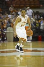 Guard D.J. Augustin, #14.  The longhorns defeated the Texas Southern University (TSU) Tigers 90-50 Tuesday night.

Filename: SRM_20061128_2048429.jpg
Aperture: f/2.8
Shutter Speed: 1/640
Body: Canon EOS-1D Mark II
Lens: Canon EF 80-200mm f/2.8 L