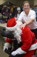 Santa Claus receives a massage at the Decker Challenge 20K 2006 road race.

Filename: SRM_20061203_1038147.jpg
Aperture: f/4.0
Shutter Speed: 1/100
Body: Canon EOS-1D Mark II
Lens: Canon EF 50mm f/1.8 II