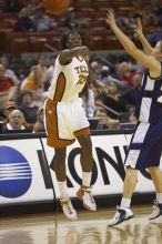 The lady longhorns defeated the Oral Roberts University's (ORU) Golden Eagles 79-40 Saturday night.

Filename: SRM_20061125_1400504.jpg
Aperture: f/2.8
Shutter Speed: 1/400
Body: Canon EOS-1D Mark II
Lens: Canon EF 80-200mm f/2.8 L