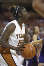 Guard and forward Gabriell Mattox, #15.  The lady longhorns defeated the Oral Roberts University's (ORU) Golden Eagles 79-40 Saturday night.

Filename: SRM_20061125_1401405.jpg
Aperture: f/2.8
Shutter Speed: 1/400
Body: Canon EOS-1D Mark II
Lens: Canon EF 80-200mm f/2.8 L