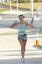 Sarah Shuler, bib #1316, places first for the women with a time of 1:02:45 at The Girl Scout Scenic 10 Miler road race, Sunday, October 22, 2006.

Filename: SRM_20061022_0857283.jpg
Aperture: f/6.3
Shutter Speed: 1/250
Body: Canon EOS 20D
Lens: Canon EF 80-200mm f/2.8 L