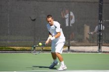 Texas' Dimitar Kutrovsky defeated Tech's Jose Muguruza 6-2 and 6-3.  The University of Texas (UT) men's tennis team defeated Georgia Tech (GT) Saturday, February 24, 2007..

Filename: SRM_20070224_1411525.jpg
Aperture: f/4.0
Shutter Speed: 1/2000
Body: Canon EOS-1D Mark II
Lens: Canon EF 80-200mm f/2.8 L