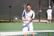 Texas' Dimitar Kutrovsky defeated Tech's Jose Muguruza 6-2 and 6-3.  The University of Texas (UT) men's tennis team defeated Georgia Tech (GT) Saturday, February 24, 2007..

Filename: SRM_20070224_1411567.jpg
Aperture: f/4.0
Shutter Speed: 1/2000
Body: Canon EOS-1D Mark II
Lens: Canon EF 80-200mm f/2.8 L