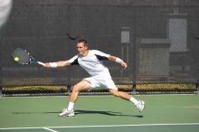 Texas' Dimitar Kutrovsky defeated Tech's Jose Muguruza 6-2 and 6-3.  The University of Texas (UT) men's tennis team defeated Georgia Tech (GT) Saturday, February 24, 2007..

Filename: SRM_20070224_1412262.jpg
Aperture: f/4.0
Shutter Speed: 1/4000
Body: Canon EOS-1D Mark II
Lens: Canon EF 80-200mm f/2.8 L