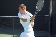 Texas' Dimitar Kutrovsky defeated Tech's Jose Muguruza 6-2 and 6-3.  The University of Texas (UT) men's tennis team defeated Georgia Tech (GT) Saturday, February 24, 2007..

Filename: SRM_20070224_1414566.jpg
Aperture: f/4.0
Shutter Speed: 1/2000
Body: Canon EOS-1D Mark II
Lens: Canon EF 80-200mm f/2.8 L