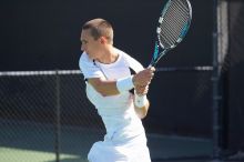 Texas' Dimitar Kutrovsky defeated Tech's Jose Muguruza 6-2 and 6-3.  The University of Texas (UT) men's tennis team defeated Georgia Tech (GT) Saturday, February 24, 2007..

Filename: SRM_20070224_1414566.jpg
Aperture: f/4.0
Shutter Speed: 1/2000
Body: Canon EOS-1D Mark II
Lens: Canon EF 80-200mm f/2.8 L