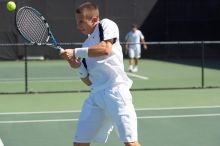 Texas' Dimitar Kutrovsky defeated Tech's Jose Muguruza 6-2 and 6-3.  The University of Texas (UT) men's tennis team defeated Georgia Tech (GT) Saturday, February 24, 2007..

Filename: SRM_20070224_1420028.jpg
Aperture: f/4.0
Shutter Speed: 1/3200
Body: Canon EOS-1D Mark II
Lens: Canon EF 80-200mm f/2.8 L