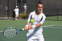 Texas' Dimitar Kutrovsky defeated Tech's Jose Muguruza 6-2 and 6-3.  The University of Texas (UT) men's tennis team defeated Georgia Tech (GT) Saturday, February 24, 2007..

Filename: SRM_20070224_1429461.jpg
Aperture: f/4.0
Shutter Speed: 1/8000
Body: Canon EOS-1D Mark II
Lens: Canon EF 80-200mm f/2.8 L