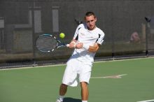 Texas' Dimitar Kutrovsky defeated Tech's Jose Muguruza 6-2 and 6-3.  The University of Texas (UT) men's tennis team defeated Georgia Tech (GT) Saturday, February 24, 2007..

Filename: SRM_20070224_1438481.jpg
Aperture: f/4.0
Shutter Speed: 1/8000
Body: Canon EOS-1D Mark II
Lens: Canon EF 80-200mm f/2.8 L