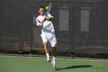 Texas' Dimitar Kutrovsky defeated Tech's Jose Muguruza 6-2 and 6-3.  The University of Texas (UT) men's tennis team defeated Georgia Tech (GT) Saturday, February 24, 2007..

Filename: SRM_20070224_1454422.jpg
Aperture: f/4.5
Shutter Speed: 1/4000
Body: Canon EOS-1D Mark II
Lens: Canon EF 80-200mm f/2.8 L