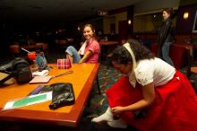 Jessica Schreyer and Sabrina Garza (right) lace up for bowling.  Alpha Xi Delta held a sock hop themed date night at the Austin 300 bowling alley, Thursday night, March 29, 2007.

Filename: SRM_20070329_2019128.jpg
Aperture: f/8.0
Shutter Speed: 1/200
Body: Canon EOS-1D Mark II
Lens: Sigma 15-30mm f/3.5-4.5 EX Aspherical DG DF