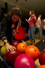 Francie Long reaching for a bowling ball.  Alpha Xi Delta held a sock hop themed date night at the Austin 300 bowling alley, Thursday night, March 29, 2007.

Filename: SRM_20070329_2034188.jpg
Aperture: f/8.0
Shutter Speed: 1/200
Body: Canon EOS-1D Mark II
Lens: Sigma 15-30mm f/3.5-4.5 EX Aspherical DG DF