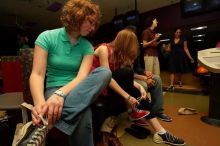 Brooke Garvey (left) and Kristen Ellefson tying their shoes before bowling.  Alpha Xi Delta held a sock hop themed date night at the Austin 300 bowling alley, Thursday night, March 29, 2007.

Filename: SRM_20070329_2038182.jpg
Aperture: f/8.0
Shutter Speed: 1/200
Body: Canon EOS-1D Mark II
Lens: Sigma 15-30mm f/3.5-4.5 EX Aspherical DG DF